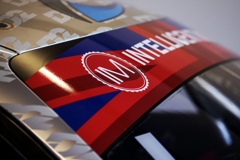 The union flag windscreen banners run to celebrate the coronation of King Charles III during free practice ahead of the SIlverstone 500.